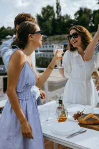 young women drinking wine